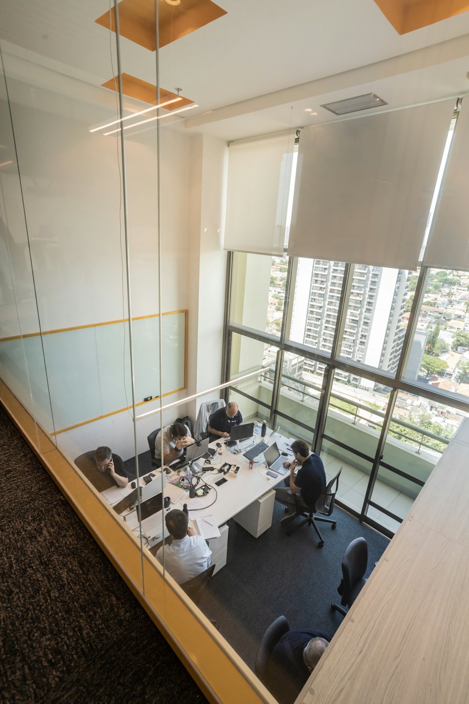 Professionals collaborating in a bright, modern open-plan office.